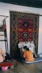 Woman making a carpet